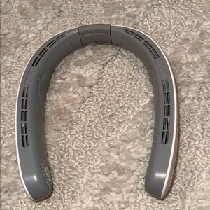 Gray and white Neck fan